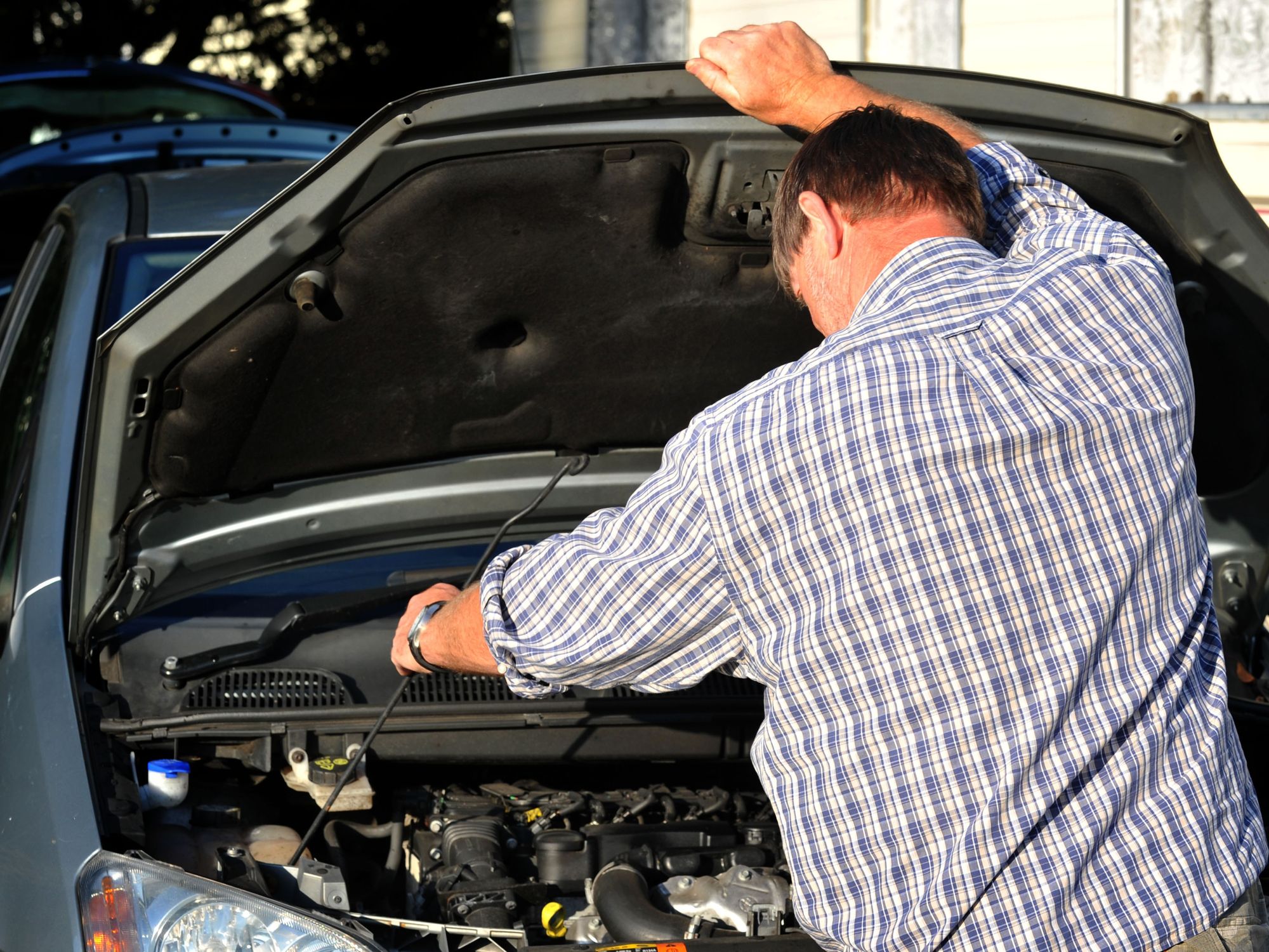 A man repairing his car