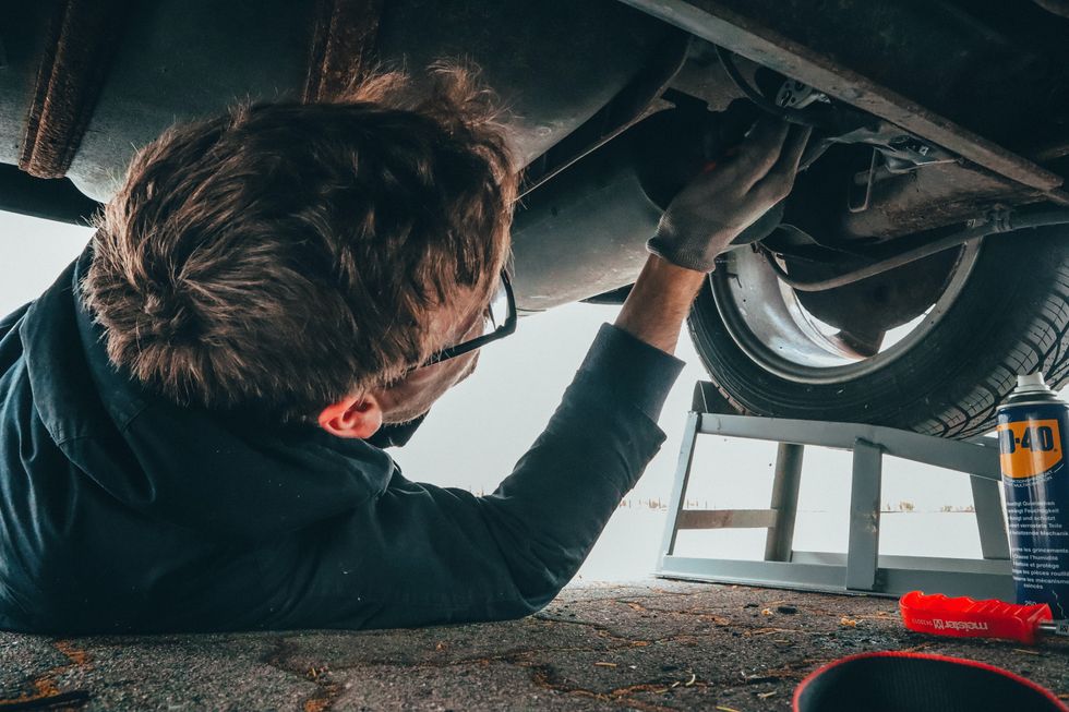 A man repairing his car
