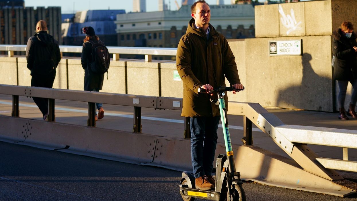 A man riding an e-scooter