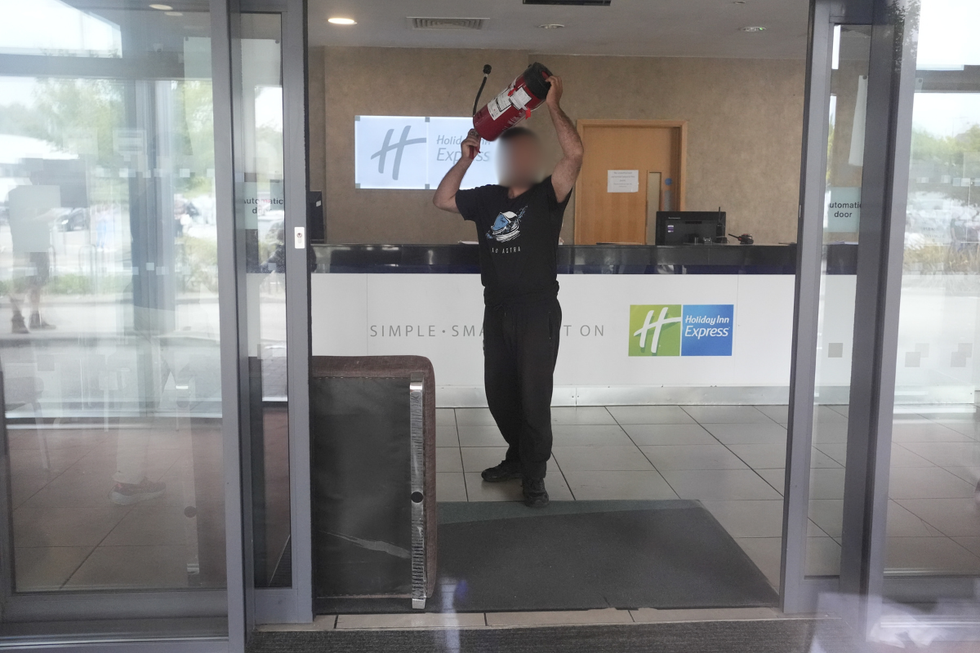 A man was seen with a fire extinguisher in the hotel lobby