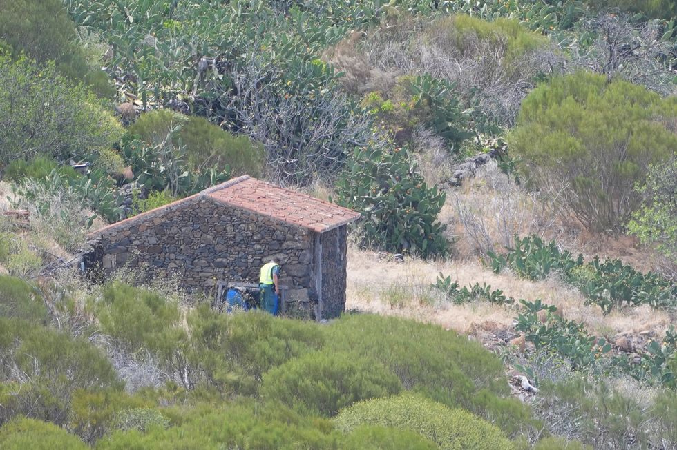 A member of a search and rescue team search near the last known location of Jay Slater, near to the village of Masca, Tenerife