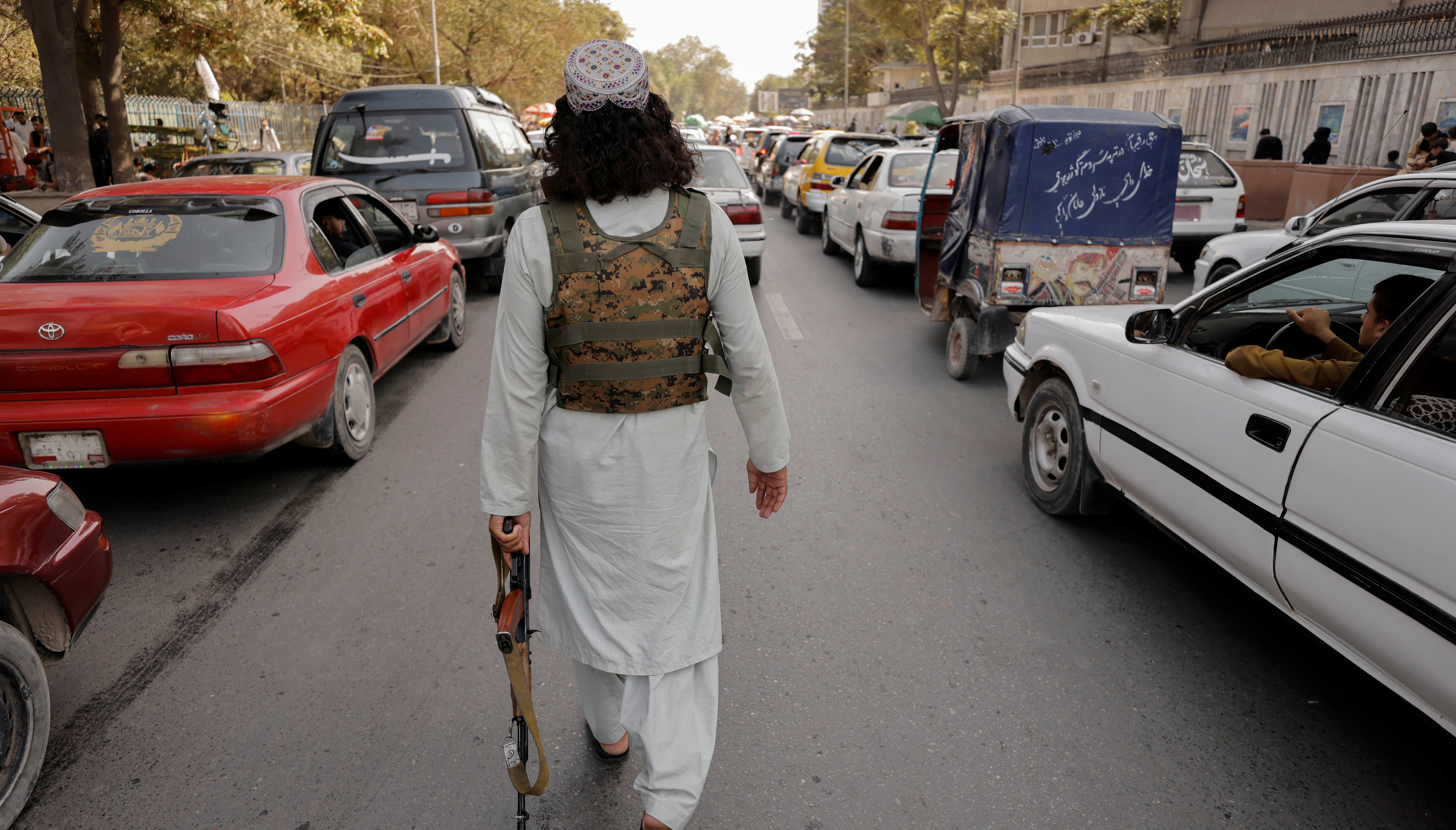 A member of Taliban forces patrols a street in Kabul, Afghanistan