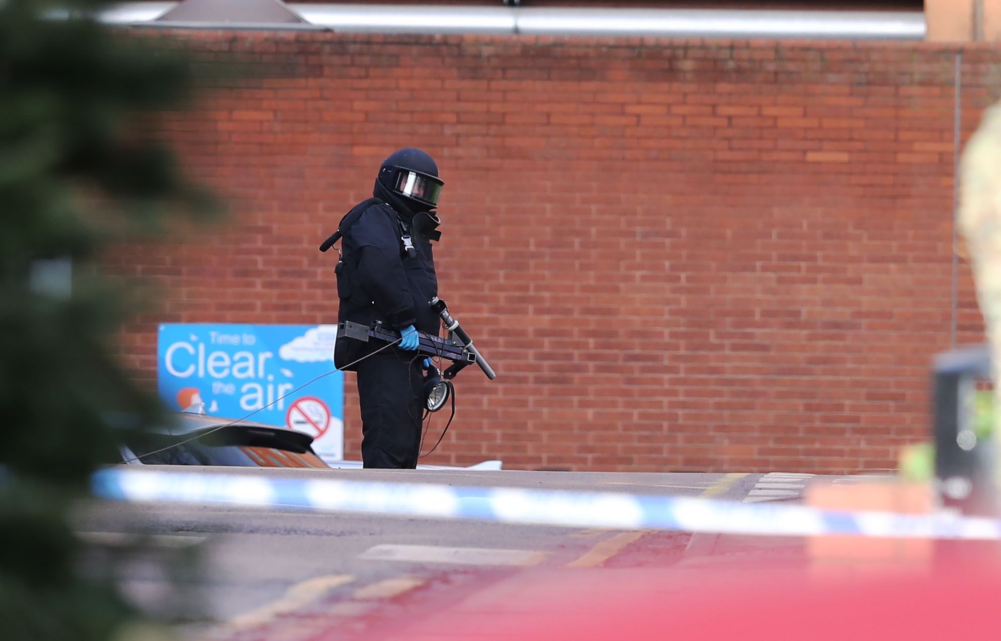 A member of the bomb disposal unit wearing protective equipment at St James's Hospital, Leeds