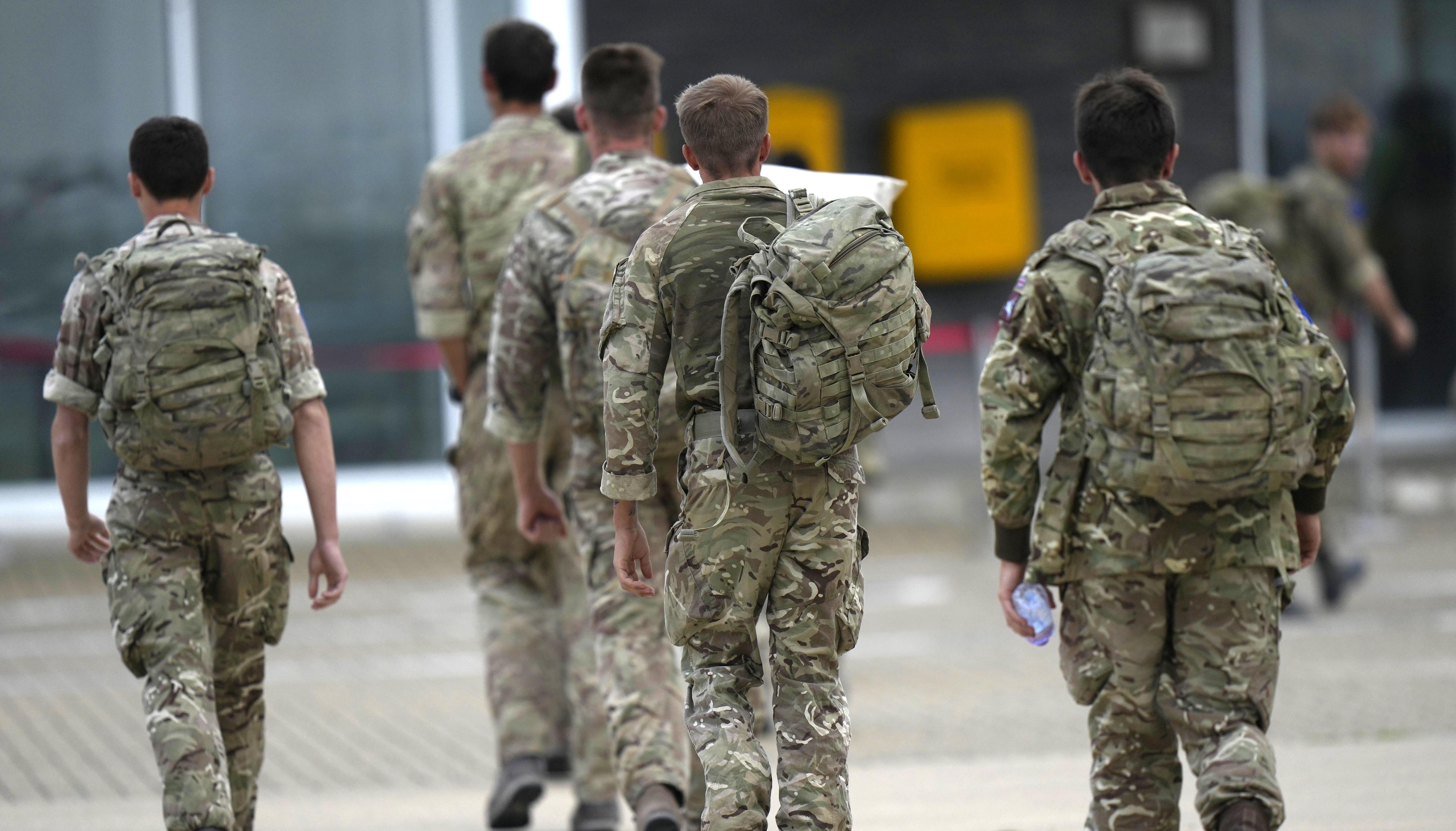 A member of the British armed forces 16 Air Assault Brigade walk to the air terminal after disembarking a RAF Voyager aircraft at RAF Brize Norton, Oxfordshire, following their return from helping in operations to evacuate people from Kabul airport in Afghanistan. Picture date: Saturday August 28, 2021.