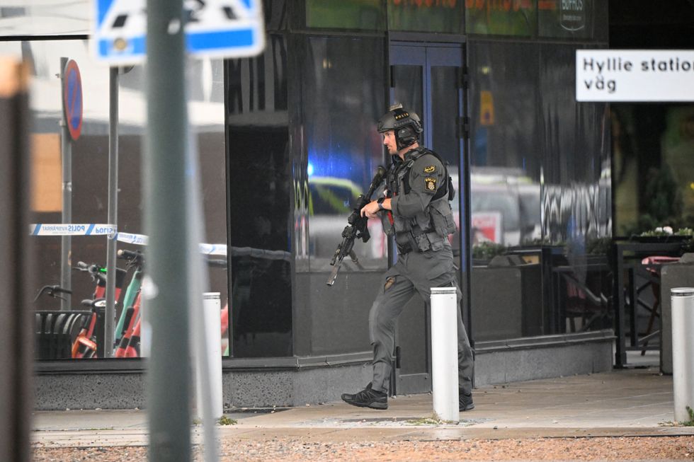 A member of the police works at the scene of a shooting at Emporia Shopping Center in Malmo, Sweden, August 19, 2022. Johan Nilsson/TT News Agency/via REUTERS ATTENTION EDITORS - THIS IMAGE WAS PROVIDED BY A THIRD PARTY. SWEDEN OUT. NO COMMERCIAL OR EDITORIAL SALES IN SWEDEN.
