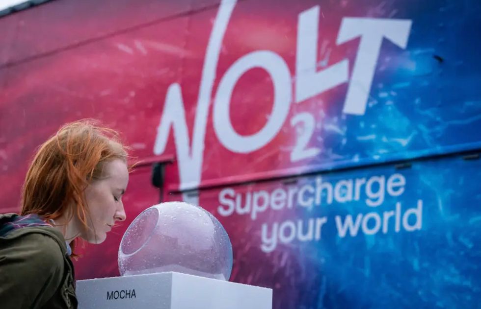 A member of the public tries taste-test vapour coffee at the Virgin Media O2 Volt pop-up at London's King's Cross Station