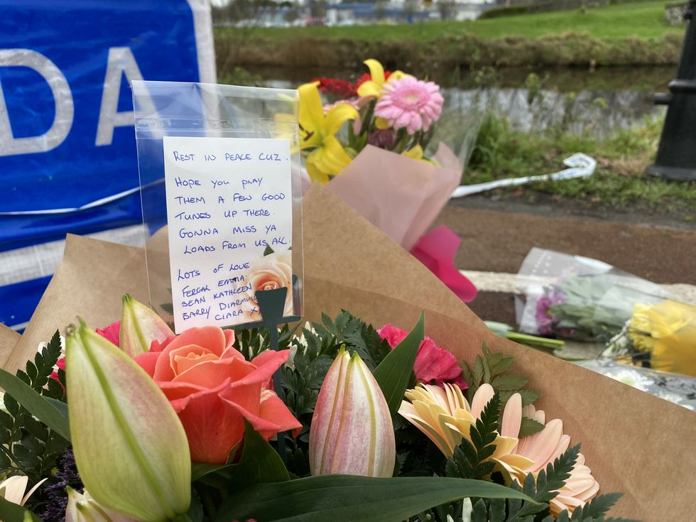 A message on flowers left at a Garda checkpoint in Tullamore after a young woman, who has been named locally as Ashling Murphy, was killed on Wednesday evening.