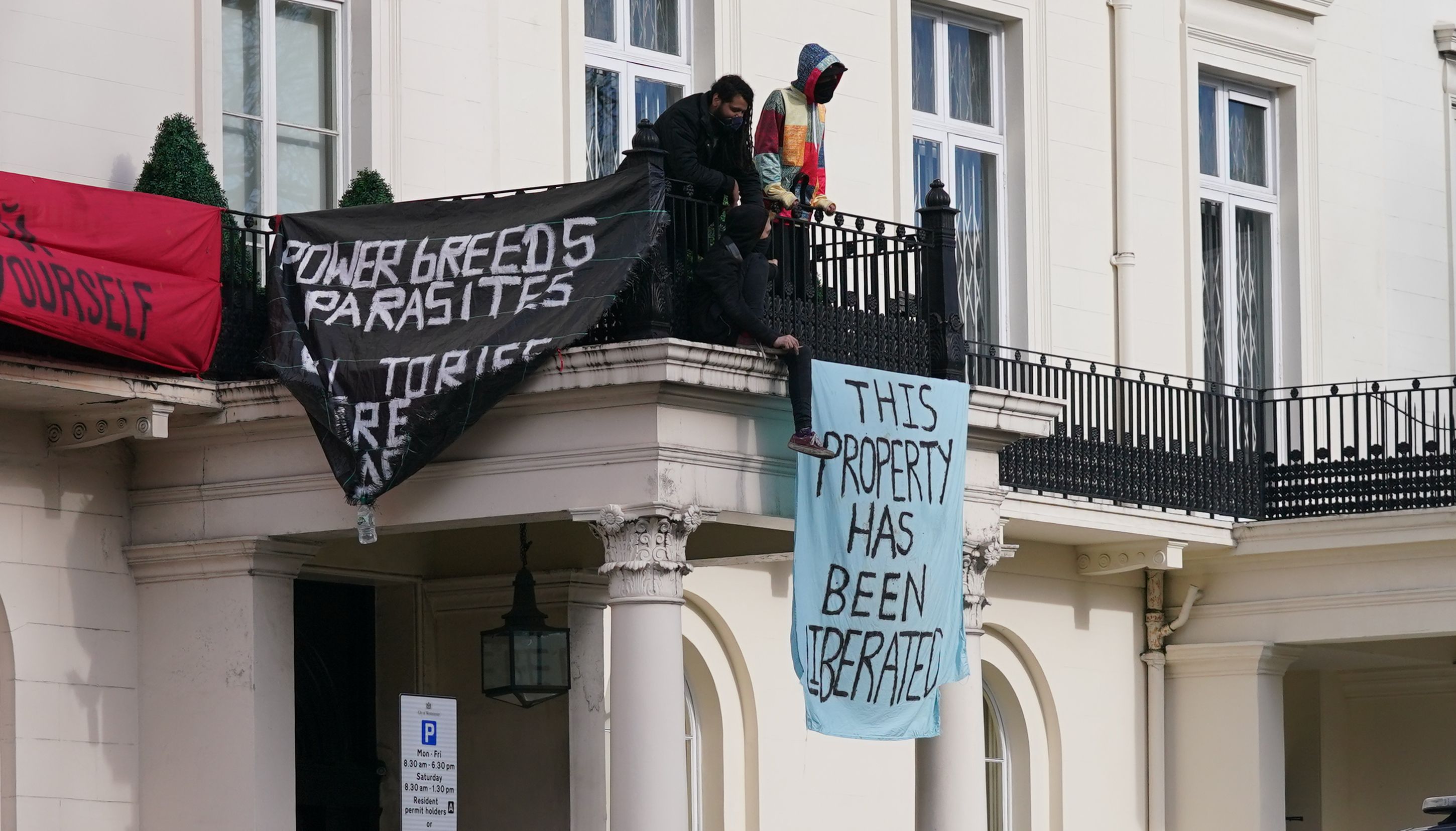 A Metropolitan Police officers watch over a group of squatters occupying a mansion belonging to Russian oligarch Oleg Deripaska in Belgrave Square, central London. Mr Deripaska, who has stakes in energy and metals company En+ Group, is one of the seven Russian oligarchs with business empires, wealth and connections that are closely associated with the Kremlin who have been sanctioned by the UK Government. Picture date: Monday March 14, 2022.