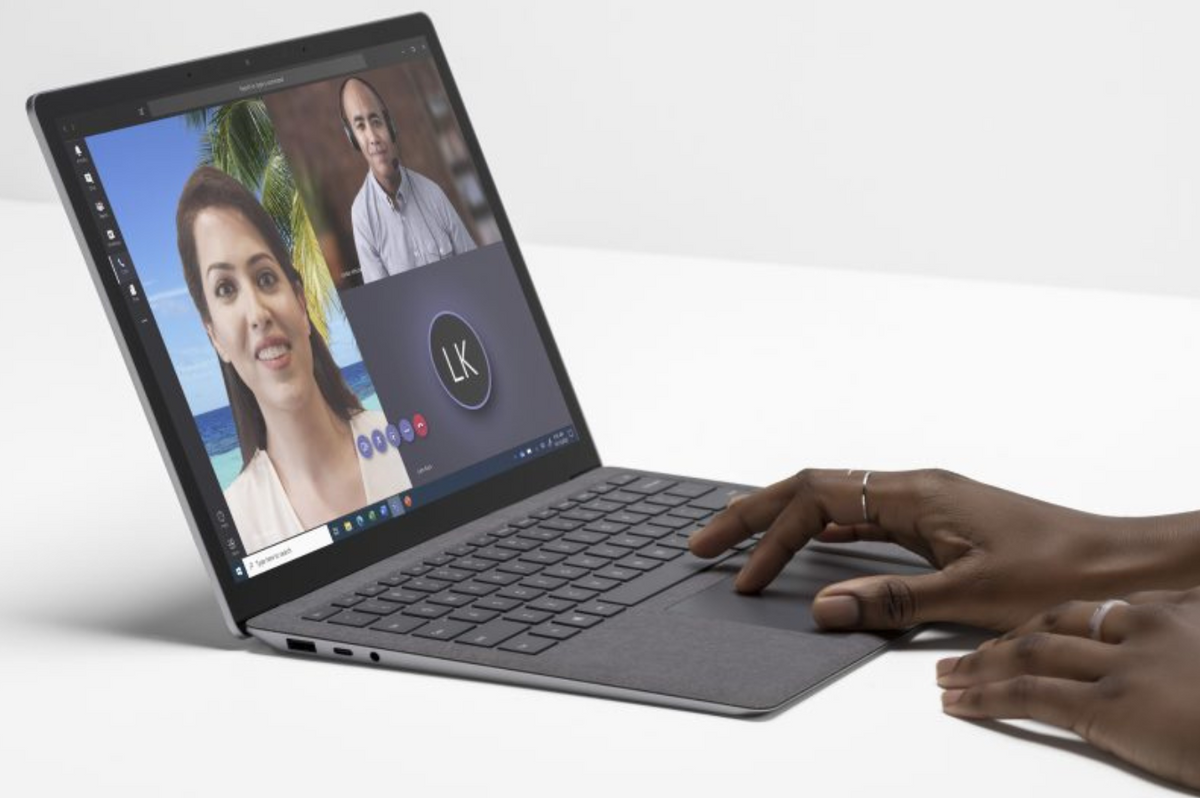 a microsoft surface laptop is pictured being used to make a video call on windows 