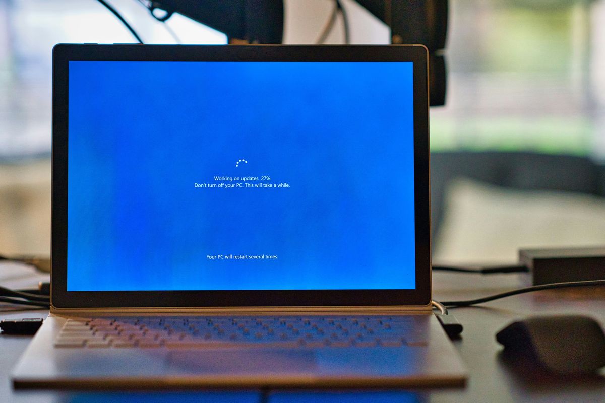 a microsoft surface laptop is pictured updating to the latest version of the windows operating system 