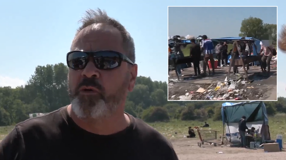 A migrant aid worker and a group of Calais migrants