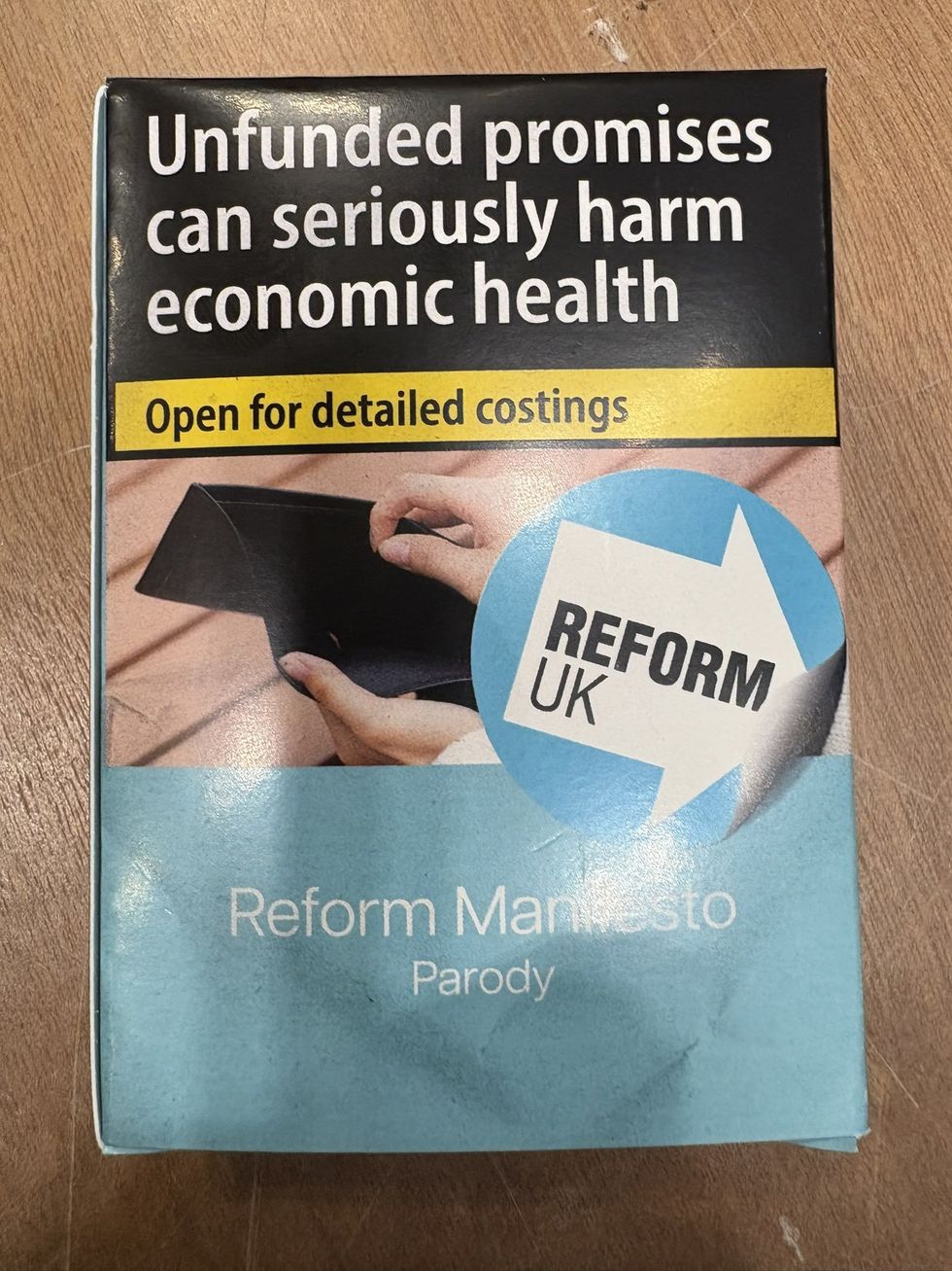 A mock-up Reform-themed cigarette packet, undoubtedly a dig at Mr Farage over his fag-puffing tendencies, included a major health warning