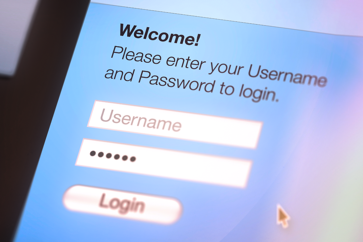 A mouse cursor hovers over the login button and password text field on a website 