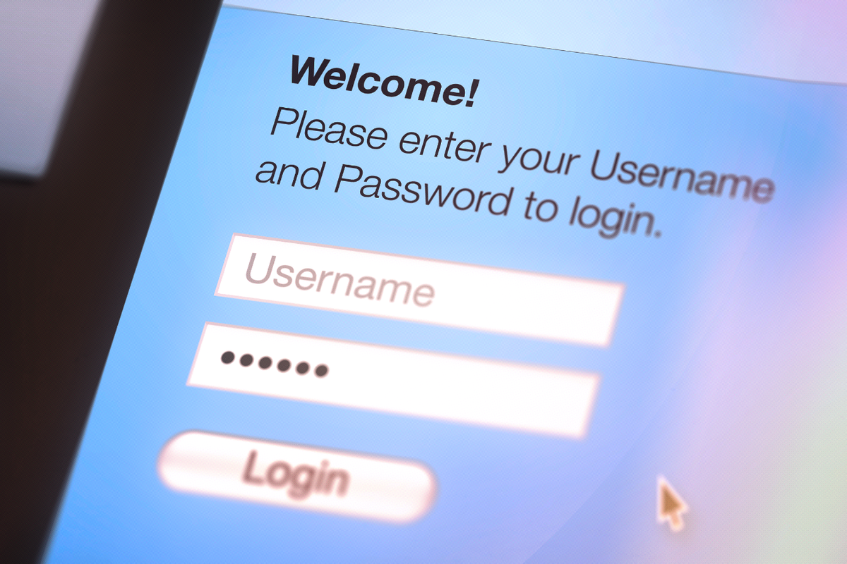 a mouse cursor moves over the Login box as someone has typed in a password into the text field 