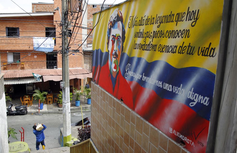 A mural of Pablo Escobar is seen in the streets at Pablo Escobar neighborhood during 30th anniversary of the late Colombian drug trafficker
