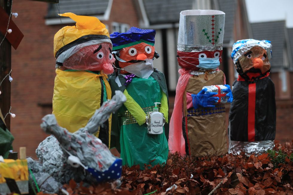 A nativity scene featuring wise men with hand sanitiser and facemasks outside the Broadway Baptist Church in Derby.