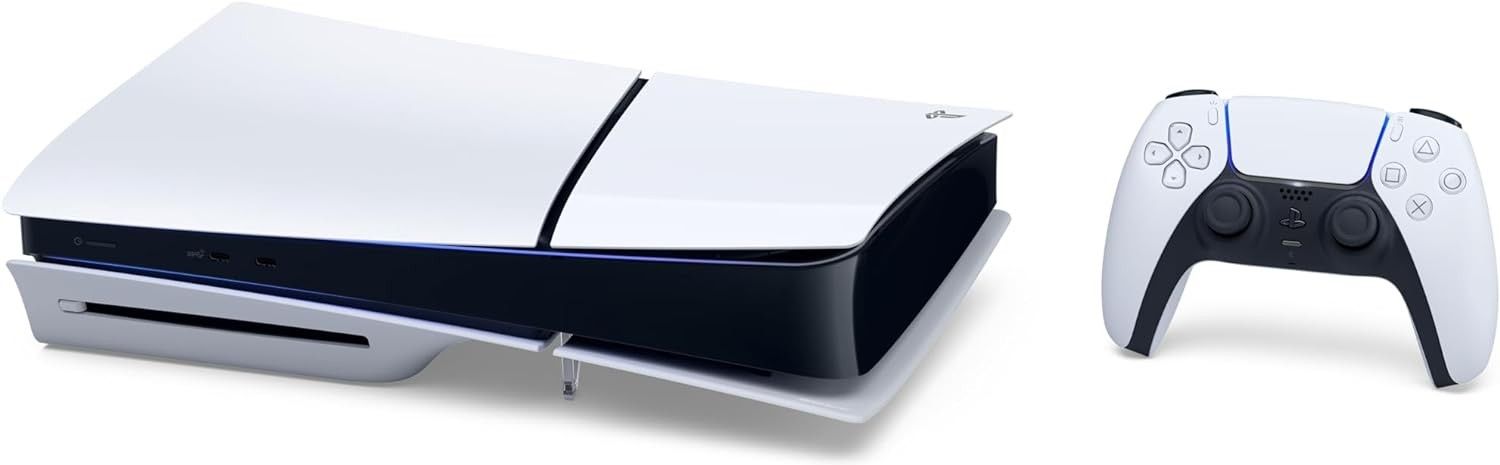a new PS5 slim lying on its side with the dualsense controller to its right