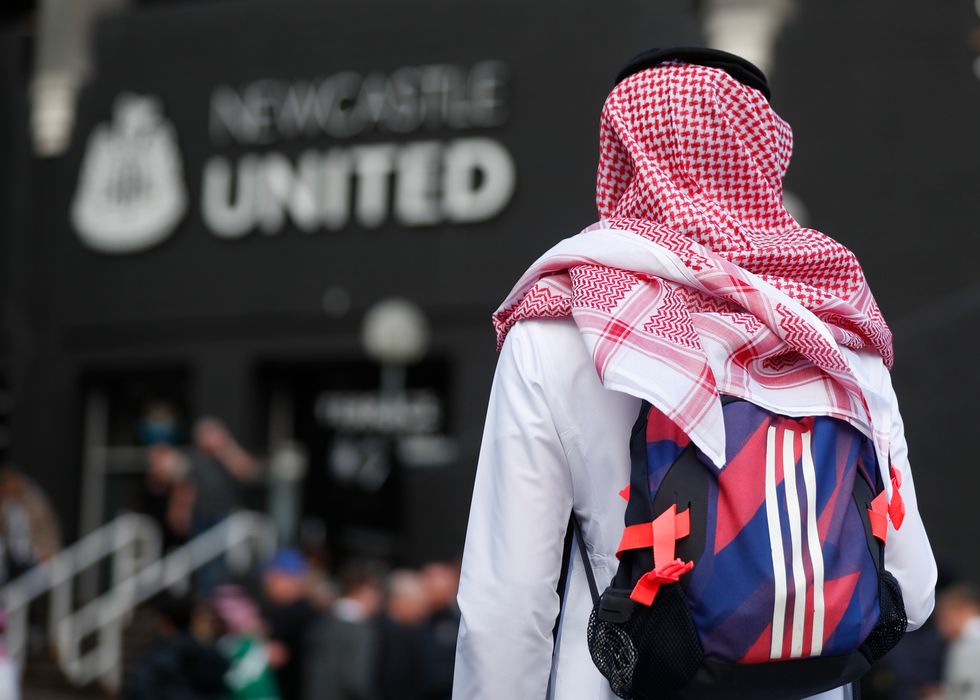 A Newcastle United fan outside the stadium before the match against Tottenham Hotspur