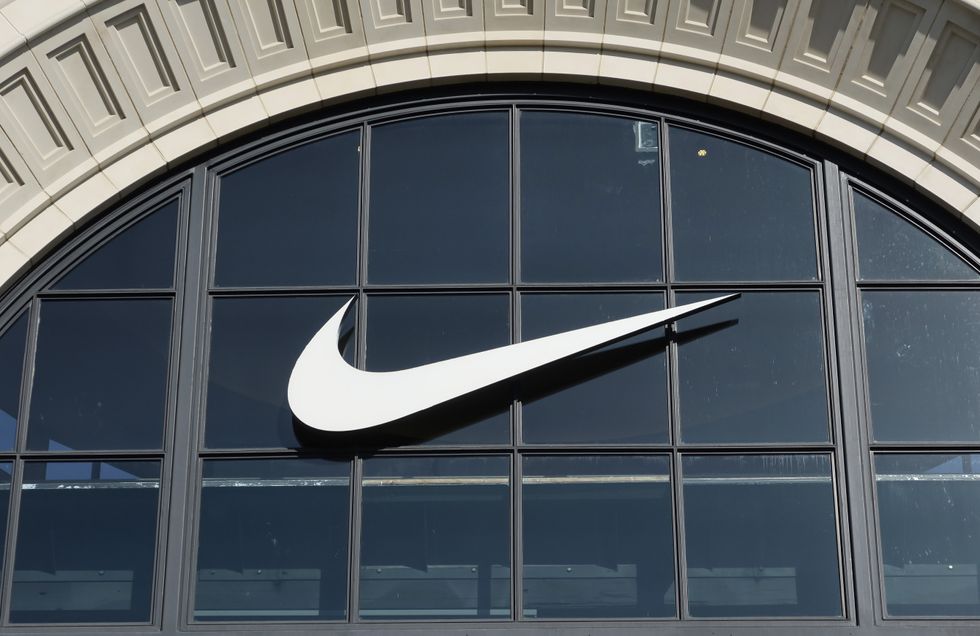 A Nike corporate logo hangs on the front of their store at The Grove
