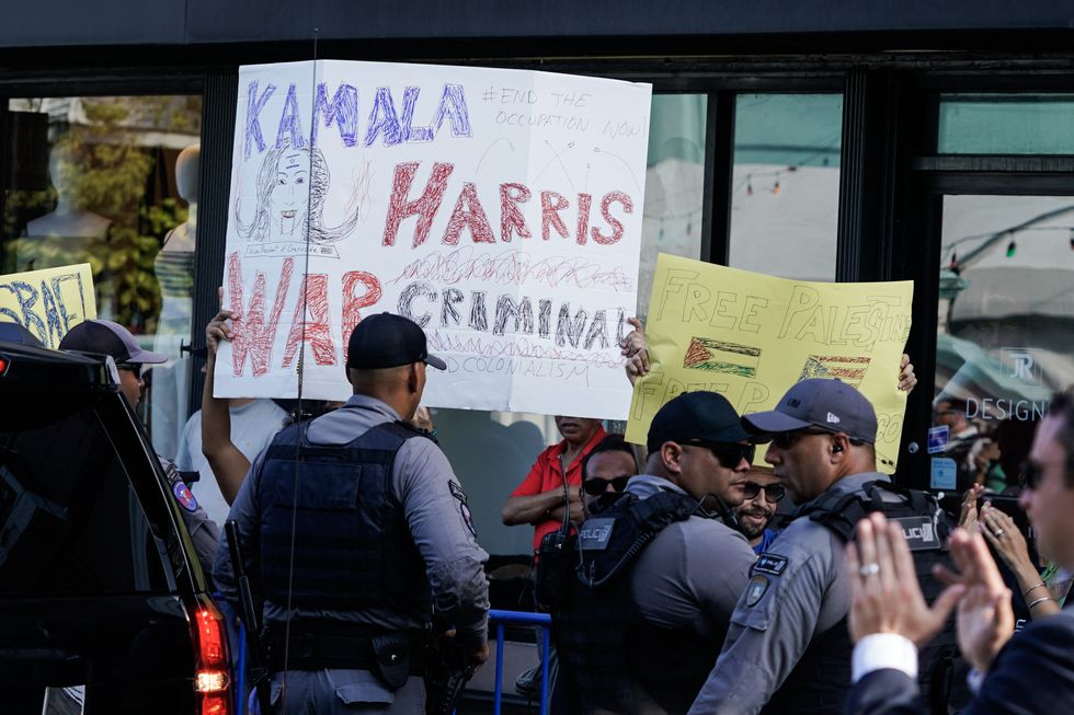 A number of protesters received Kamala Harris on her arrival