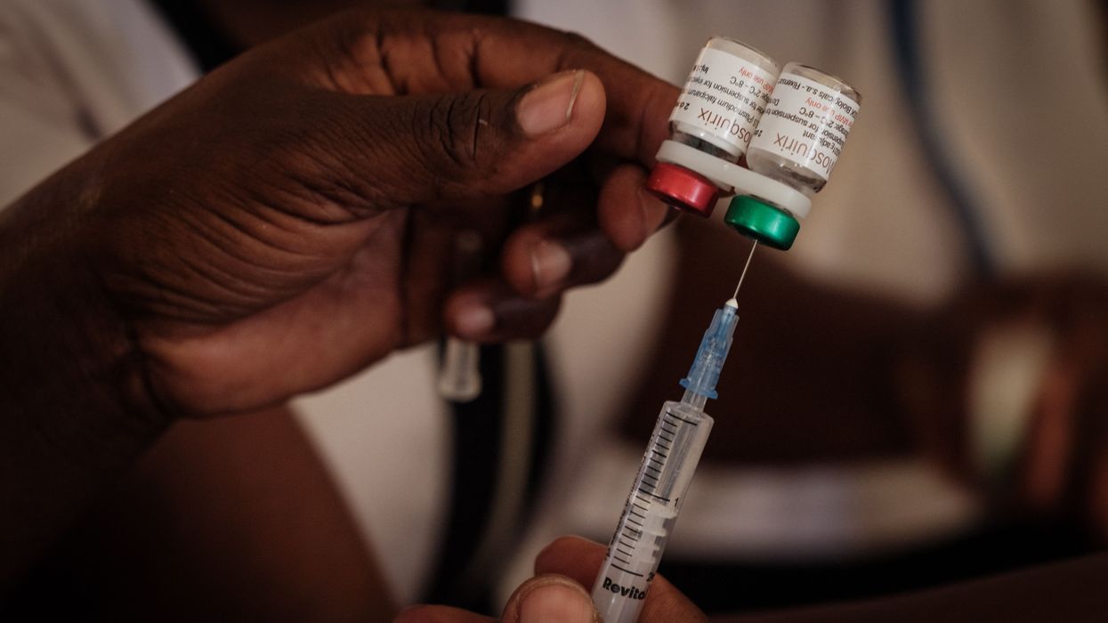 A nurse prepares a shot during the launch of the extension of the worlds first malaria vaccine