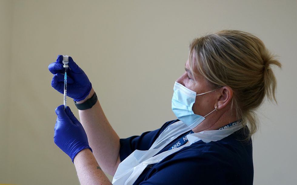 A nurse preparing a vaccine