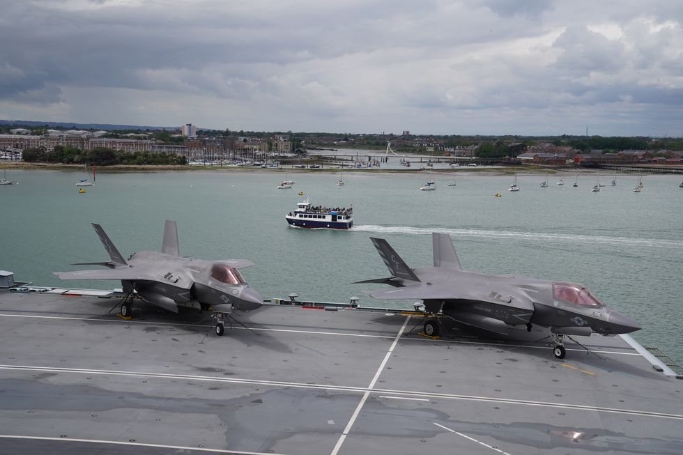 A pair of F-35B Lightning II jets on the flight deck during Queen Elizabeth II's visit to HMS Queen Elizabeth at HM Naval Base, Portsmouth