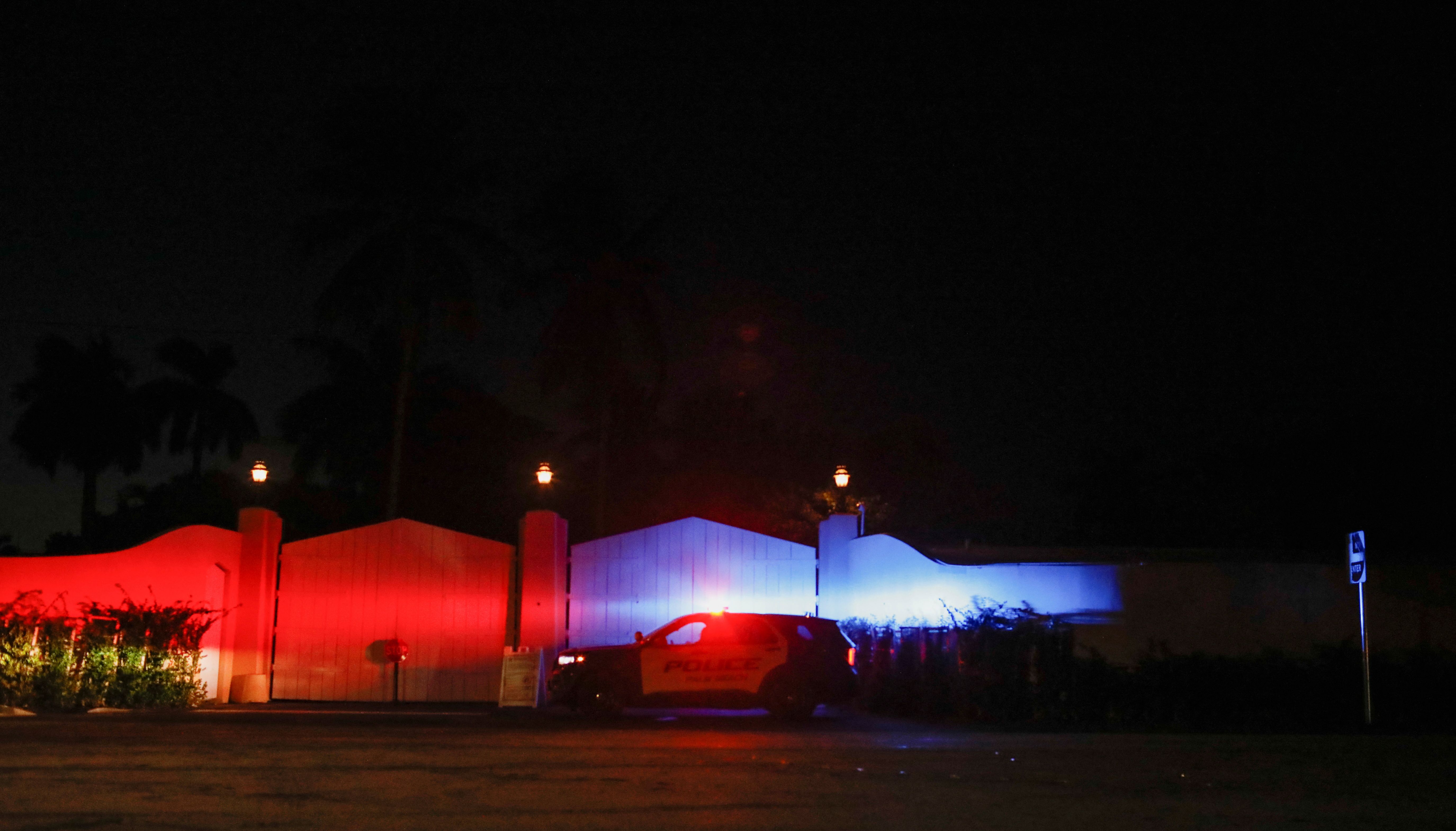 A Palm Beach police vehicle is parked outside Donald Trump's Mar-a-Lago home