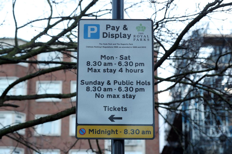 A parking restriction notice on South Carriage Drive in Hyde Park, London