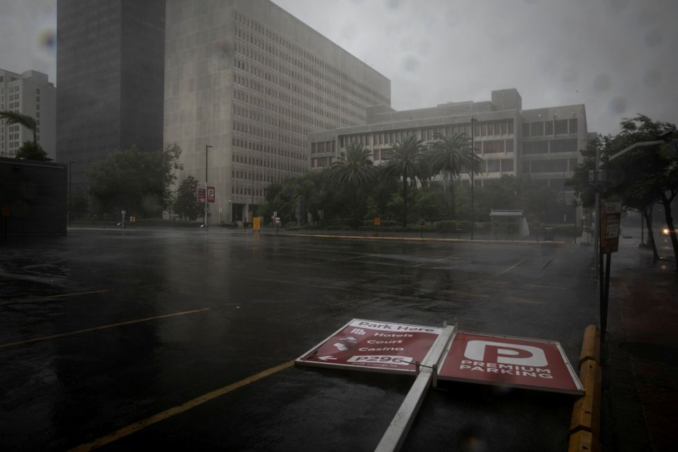 A parking sign lies in the street as Hurricane Ida makes landfall in Louisiana, in New Orleans.