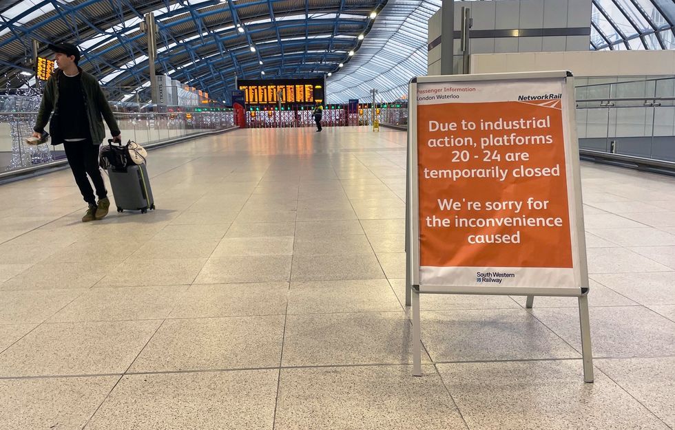 A passenger at Waterloo train station in London during a rail strike by members of the Rail, Maritime and Transport union (RMT), in a long-running dispute over jobs and pensions. Picture date: Saturday January 7, 2023.