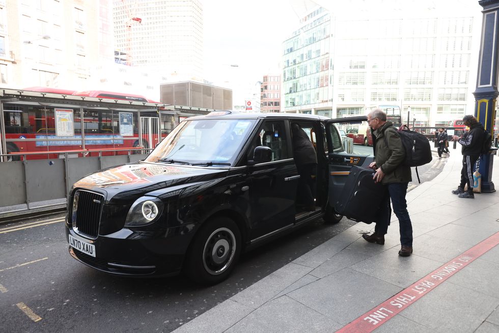 A passenger enters a taxi outside Victoria Station, in London during a strike by members of the Rail, Maritime and Transport union (RMT), as commuters face another day of travel chaos on Thursday due to a fresh strike by thousands of workers which will cripple Tube services in London. Picture date: Thursday March 3, 2022.