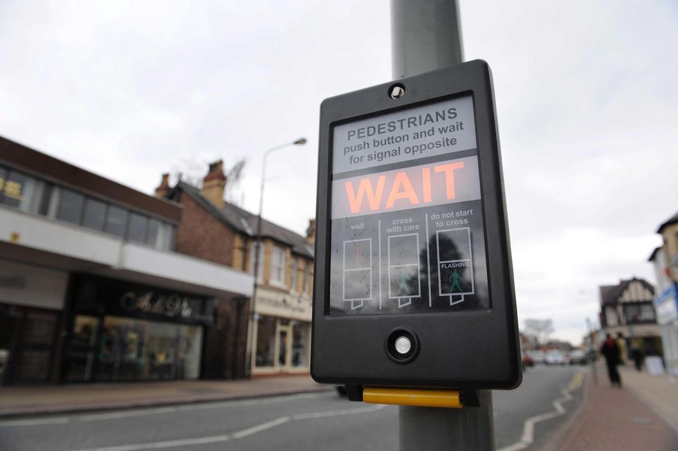 A pelican crossing sign in Hale, Altrincham.