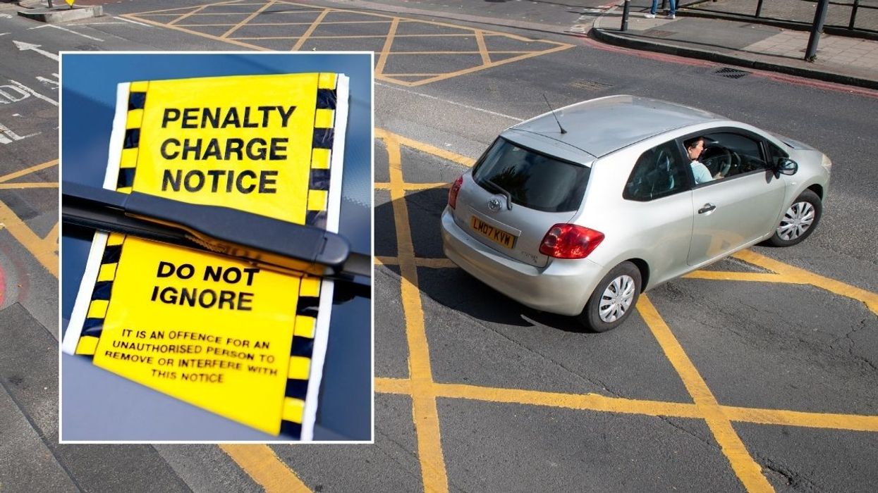 A penalty charge notice and a car driving inside a yellow box junction