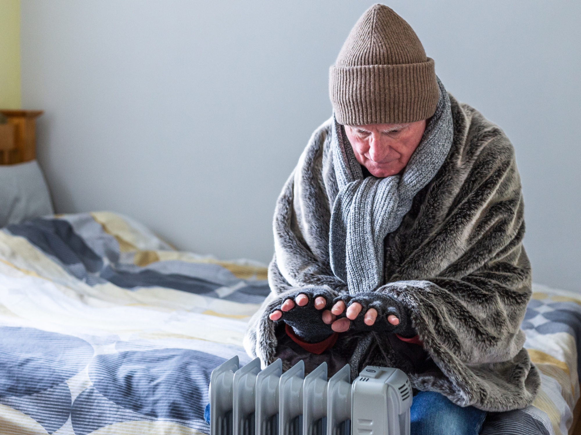 A pensioner warming themselves