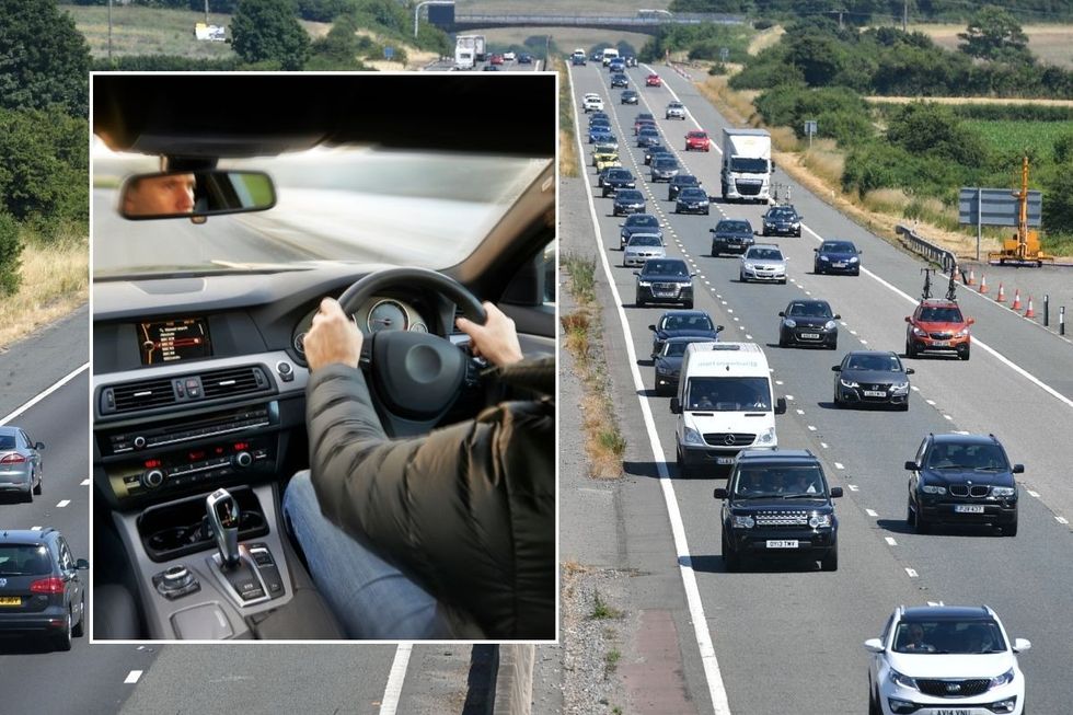 A person driving a car and a busy road