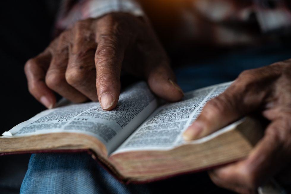 A person holding the Bible