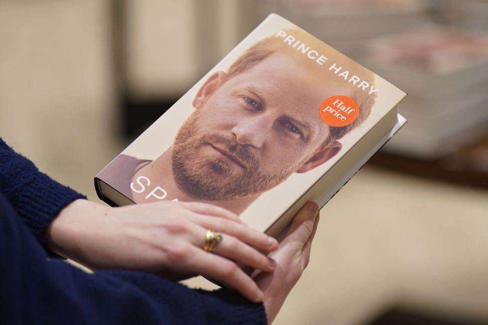A person holds a copy of the newly released autobiography from the Duke of Sussex, titled Spare, at Waterstones Piccadilly, London, as it goes on sale to the public for the fist time. Picture date: Tuesday January 10, 2023.