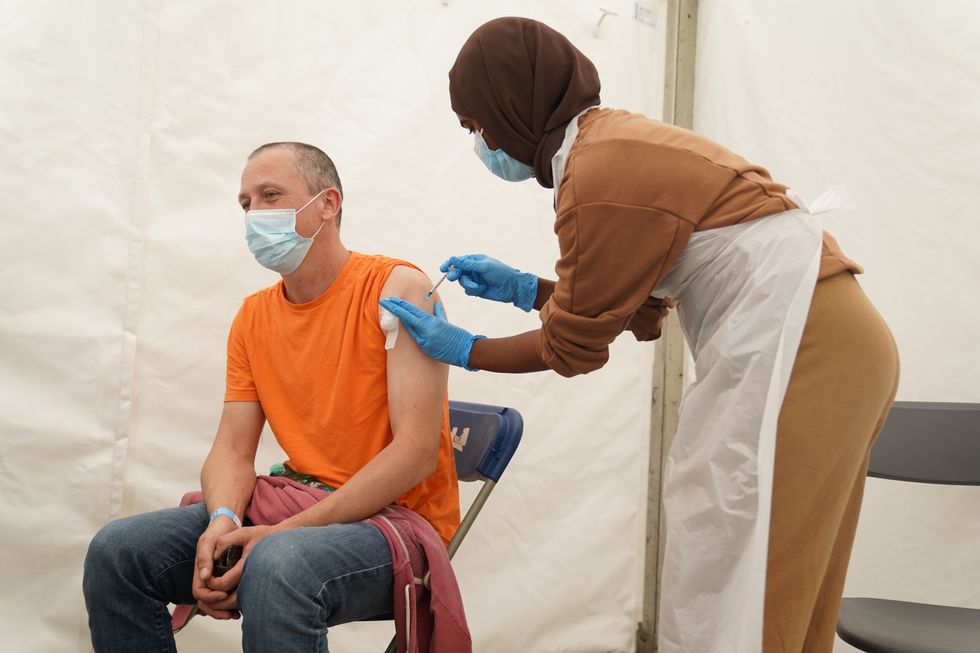 A person receives a Covid-19 jab at a pop-up vaccination centre during a four-day vaccine festival in Langdon Park, Poplar.