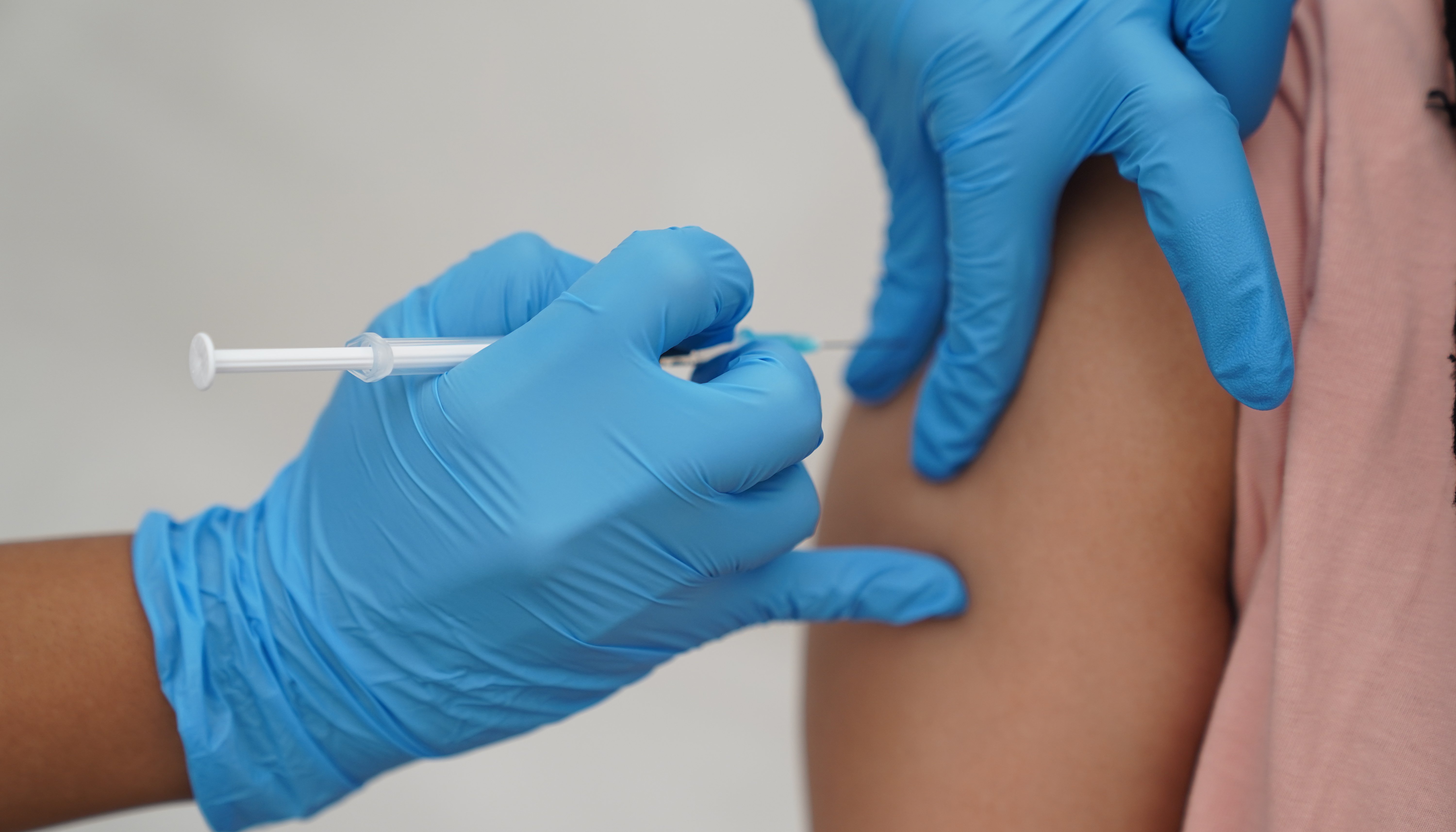 A person receives a Covid-19 jab at a pop-up vaccination centre during a four-day vaccine festival in Langdon Park, Poplar.