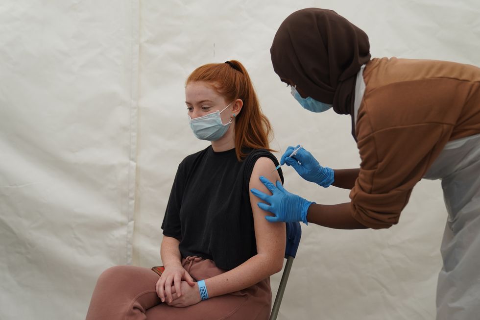 A person receives a Covid-19 jab at a pop-up vaccination centre during a four-day vaccine festival