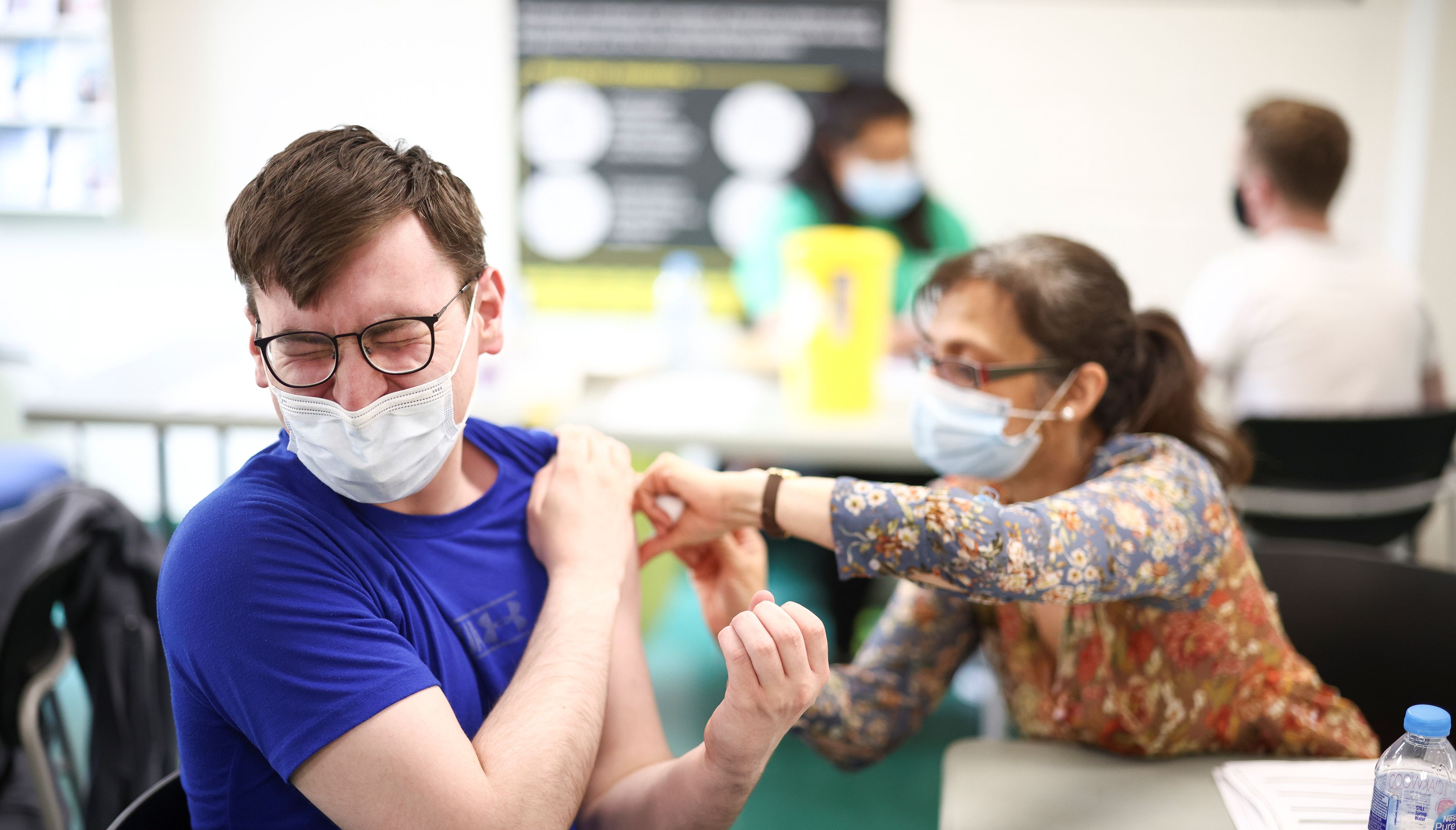 A person receives a dose of the Pfizer BioNTech vaccine at a vaccination centre for those aged over 18 years old.
