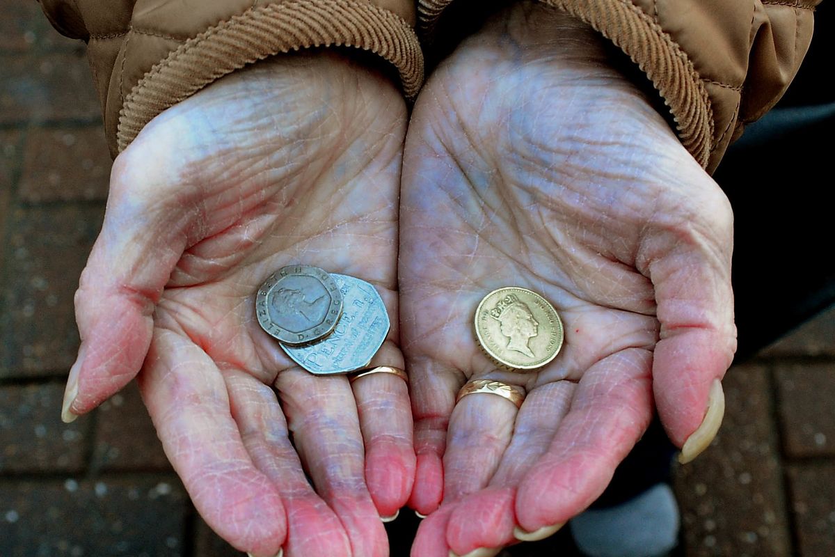 A person shows coins
