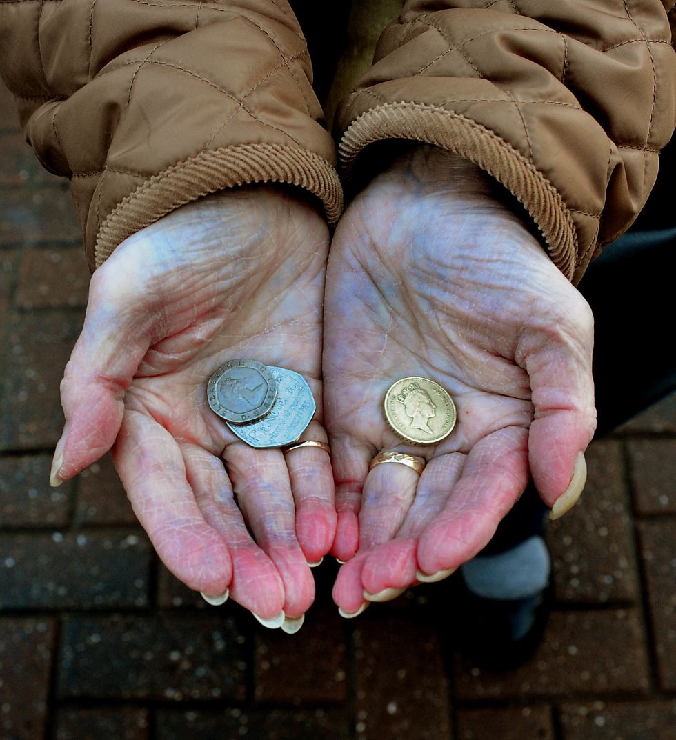 A person shows coins