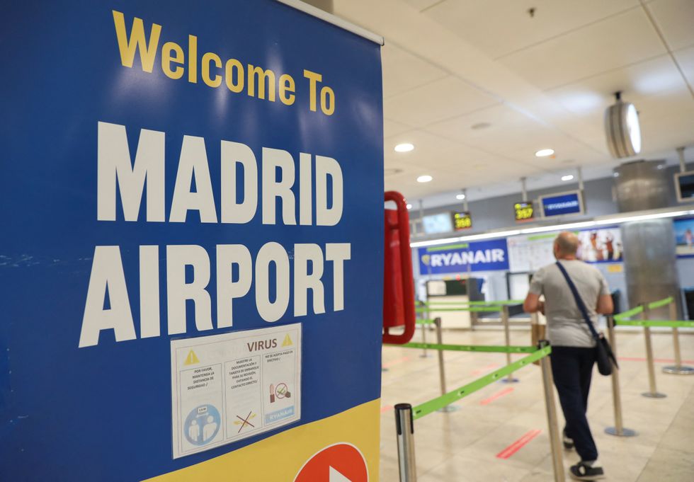 A person walks at the Ryanair check-in area at Adolfo Suarez Madrid-Barajas Airport, in Madrid, Spain, June 22 2022. REUTERS/Isabel Infantes