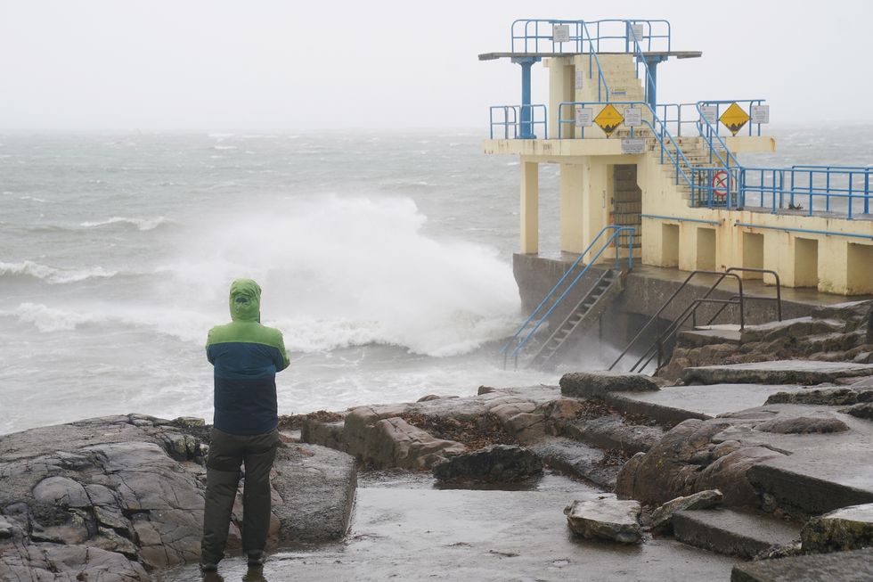 A person watches the waves at the Blackrock diving tower in Salthill, Galway,\u200b