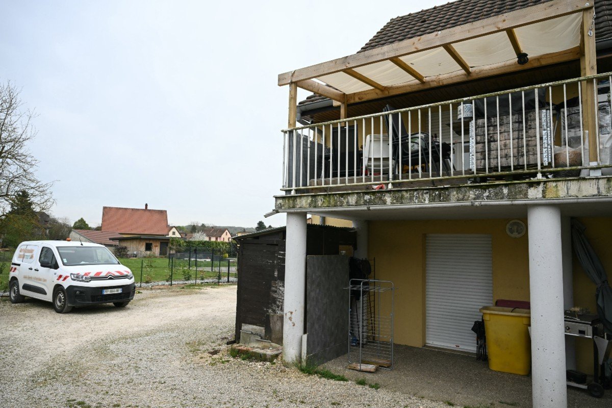 A photo shows a residential building, with the involved suspects' terrace at the first level (R), and parking area at the location where a boy was discovered naked and malnourished on a pile of rubbish in a van where he had been kept locked up, in Hagenbach, eastern France, on April 10, 2026