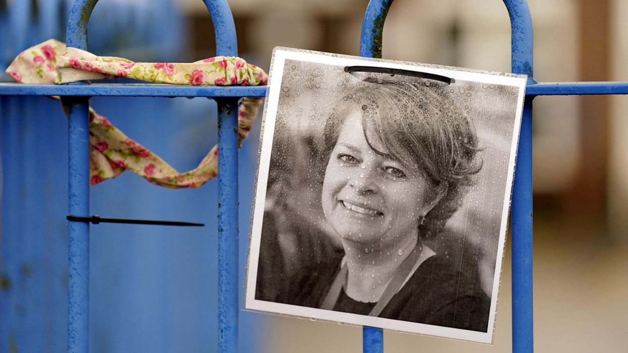 A photograph of Ruth Perry attached to the fence outside John Rankin Schools in Newbury