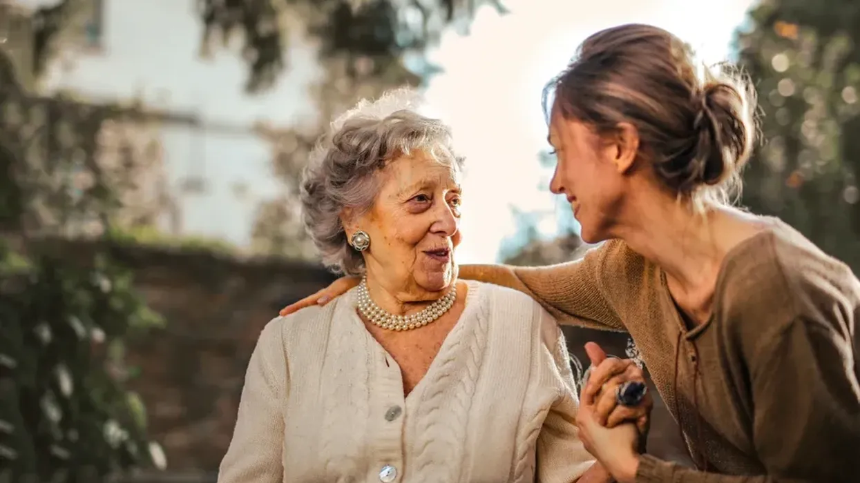 A picture of an old woman with a younger woman