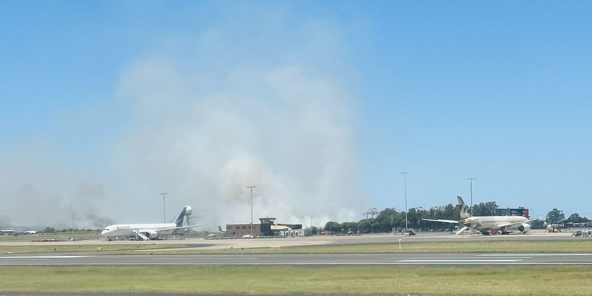 NextImg:Sydney Airport runway on FIRE after 'loud bang' heard on plane as flights aborted